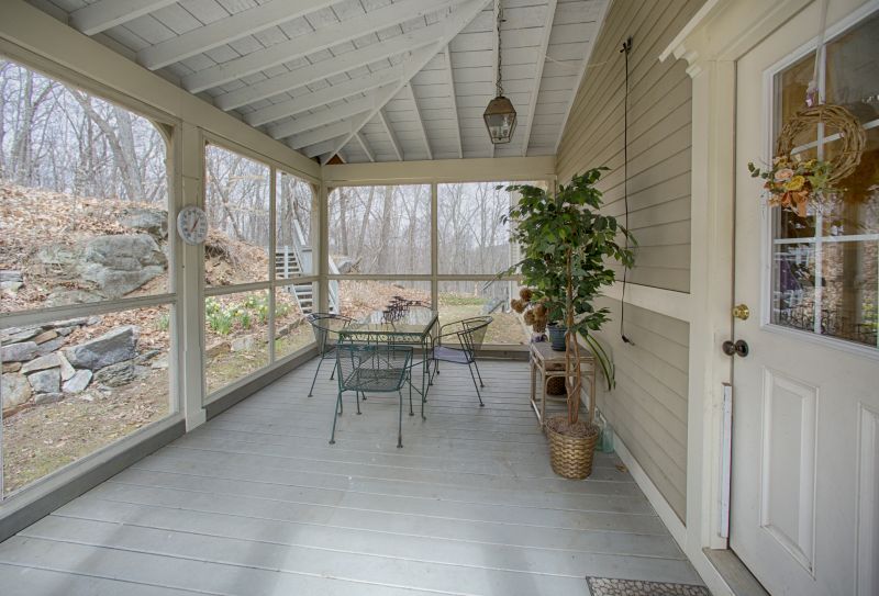 How A Freestanding Porch Installation Enhances Backyard Functionality